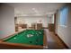 Fun game room with pool table, cozy seating, a bar area, and plenty of space for entertainment at 3299 S Newcombe St, Lakewood, CO 80227