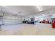 Spacious garage area with multiple garage doors and ample workspace at 3299 S Newcombe St, Lakewood, CO 80227
