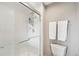 This bathroom features a glass enclosed shower with white tile surround, providing a sleek and modern design at 9400 E Iliff Ave # 181, Denver, CO 80231