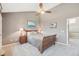 Comfortable bedroom with ceiling fan and neutral tones at 9400 E Iliff Ave # 181, Denver, CO 80231