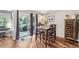 The dining area has glass doors to a covered patio and hardwood floors at 9400 E Iliff Ave # 181, Denver, CO 80231