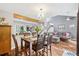 Dining area with seating for six features hardwood floors and is open to the living room at 9400 E Iliff Ave # 181, Denver, CO 80231