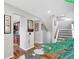 Entryway features hardwood floors, coat rack and view of the stairs and kitchen at 9400 E Iliff Ave # 181, Denver, CO 80231