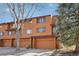 Exterior facade showcasing attached garages and well-maintained siding at 9400 E Iliff Ave # 181, Denver, CO 80231