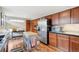 Kitchen with hardwood floors, stainless steel appliances, and natural light at 9400 E Iliff Ave # 181, Denver, CO 80231