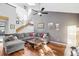 Bright living room with vaulted ceilings, hardwood floors, and staircase at 9400 E Iliff Ave # 181, Denver, CO 80231