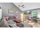 Living room featuring a fireplace, vaulted ceiling, and large sofa at 9400 E Iliff Ave # 181, Denver, CO 80231