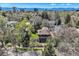 Aerial view showcasing a charming neighborhood with mature trees, green spaces, and mountain views at 171 N Franklin St, Denver, CO 80218