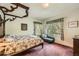 Bedroom featuring a wooden canopy bed with floral bedding, large windows, and a decorative chaise lounge at 171 N Franklin St, Denver, CO 80218