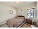 Bedroom with neutral walls, a patterned rug and a bed and dresser near the window at 171 N Franklin St, Denver, CO 80218
