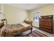 Bedroom with a single bed and patterned bedding, complemented by a hardwood dresser and an area rug at 171 N Franklin St, Denver, CO 80218