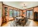 Elegant dining room with hardwood floors, wood trim, large table, and natural light at 171 N Franklin St, Denver, CO 80218