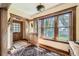 Light-filled foyer features hardwood floors, wood trim, and a charming vintage rug at 171 N Franklin St, Denver, CO 80218