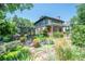 Beautiful two-story home boasts professionally landscaped yard, pergola, brickwork and lush greenery at 171 N Franklin St, Denver, CO 80218