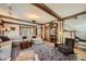 Spacious living room with hardwood floors, beamed ceilings, and staircase to second floor at 171 N Franklin St, Denver, CO 80218