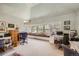 A bright home office with multiple desks, an array of windows, and light blue walls at 171 N Franklin St, Denver, CO 80218
