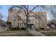 Apartment building exterior features brick facade, classic design and landscaping at 505 N Logan St # 14, Denver, CO 80203