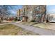 Charming multi-story building with a lush lawn, mature trees, and ample street parking at 505 N Logan St # 14, Denver, CO 80203