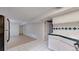 Efficient kitchen with modern refrigerator, updated cabinets and bright natural light at 505 N Logan St # 14, Denver, CO 80203