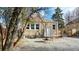 Charming backyard of stone home with a brick patio and gravel, enclosed with a wooden fence at 1621 Trenton St, Denver, CO 80220