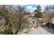 This backyard view shows a private outdoor area complete with a stone patio, and a fence at 1621 Trenton St, Denver, CO 80220