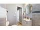 Modern bathroom with updated fixtures, a sleek vanity, and stylish tile accents throughout at 1621 Trenton St, Denver, CO 80220