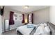 Cozy bedroom with two windows, carpet, and comfortable bed at 1621 Trenton St, Denver, CO 80220
