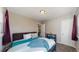 Comfortable bedroom with ample natural light and neutral décor at 1621 Trenton St, Denver, CO 80220