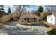 Classic home with a cozy front porch, manicured yard, and convenient street access at 1621 Trenton St, Denver, CO 80220