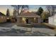Charming home featuring a front yard, stonework and covered porch with front door at 1621 Trenton St, Denver, CO 80220