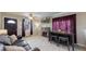 Cozy living room featuring a stone fireplace, wood floors, modern furnishings, and a comfortable seating area at 1621 Trenton St, Denver, CO 80220