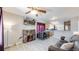 Inviting living room featuring a cozy fireplace, hardwood floors, and lots of natural light at 1621 Trenton St, Denver, CO 80220