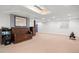 Spacious finished basement with neutral carpet, recessed lighting, and decorative wood trim at 9963 W Canyon Ave, Littleton, CO 80127