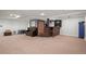 Finished basement featuring a retro-style bar area, perfect for entertaining guests and creating a fun atmosphere at 9963 W Canyon Ave, Littleton, CO 80127