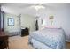 Bedroom featuring a large bed, carpet, and rainbow decor at 9963 W Canyon Ave, Littleton, CO 80127