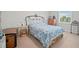 Bright bedroom featuring natural light, a bed, and wood accents at 9963 W Canyon Ave, Littleton, CO 80127