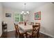 Charming dining room with elegant chandelier and views to the back yard at 9963 W Canyon Ave, Littleton, CO 80127