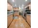 Open kitchen featuring stone countertops, stainless appliances and eat in nook at 9963 W Canyon Ave, Littleton, CO 80127