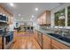 Well-equipped kitchen leading to a spacious, open-concept living area at 9963 W Canyon Ave, Littleton, CO 80127