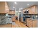 Spacious kitchen with granite countertops and stainless steel appliances at 9963 W Canyon Ave, Littleton, CO 80127