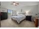 Serene primary bedroom with vaulted ceilings and natural light from large window at 9963 W Canyon Ave, Littleton, CO 80127