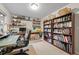 Home office featuring a desk, carpet, shelves, and a bookcase at 9963 W Canyon Ave, Littleton, CO 80127