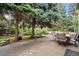 Outdoor patio space with mature trees and lawn, perfect for al fresco dining and relaxation at 9963 W Canyon Ave, Littleton, CO 80127