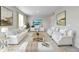 Elegant living room featuring modern decor, plush seating, and bright natural light at 1898 Westport Ave, Berthoud, CO 80513