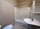 Clean bathroom with a shower-tub combo, tile flooring, and a vanity sink at 4159 Wyandot St, Denver, CO 80211