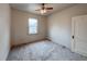 Neutral bedroom featuring a ceiling fan, a large window, and a spacious closet at 4159 Wyandot St, Denver, CO 80211