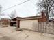 Detached garage with covered parking structure to the left at 4159 Wyandot St, Denver, CO 80211