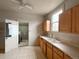 Kitchen with white counter tops, light wood cabinets, and tile flooring at 4159 Wyandot St, Denver, CO 80211