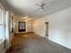 Living room featuring a ceiling fan and large windows at 4159 Wyandot St, Denver, CO 80211