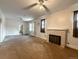 Spacious living room with a decorative fireplace and a ceiling fan at 4159 Wyandot St, Denver, CO 80211